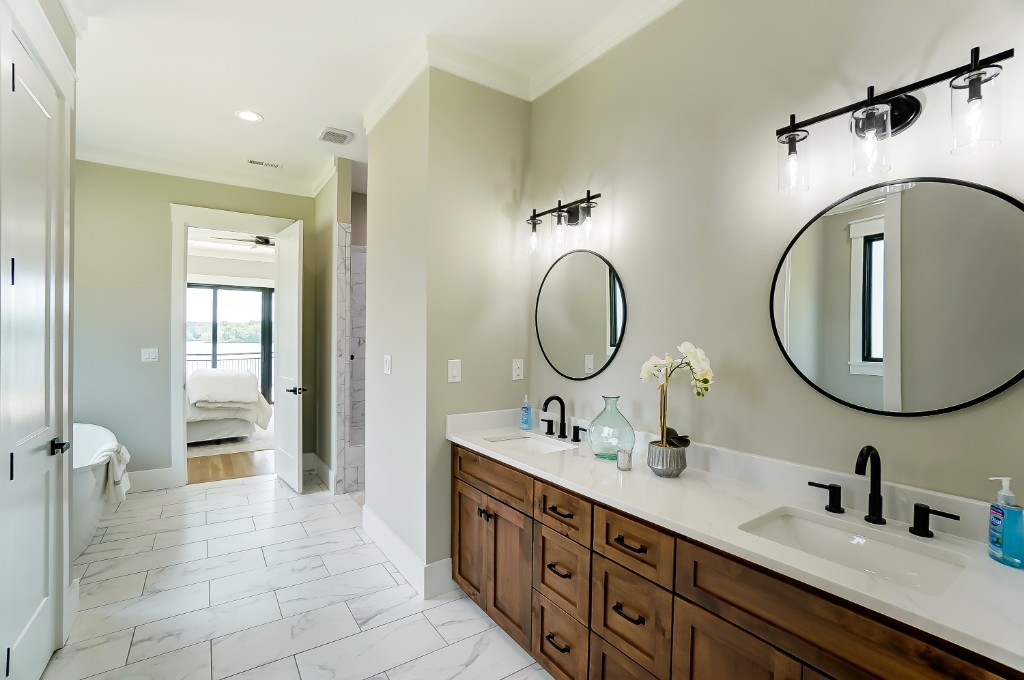 Double vanity bathroom with lake view